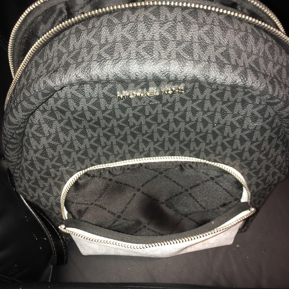 Michael Kors back pack purse in very great condition with MK prints on it!